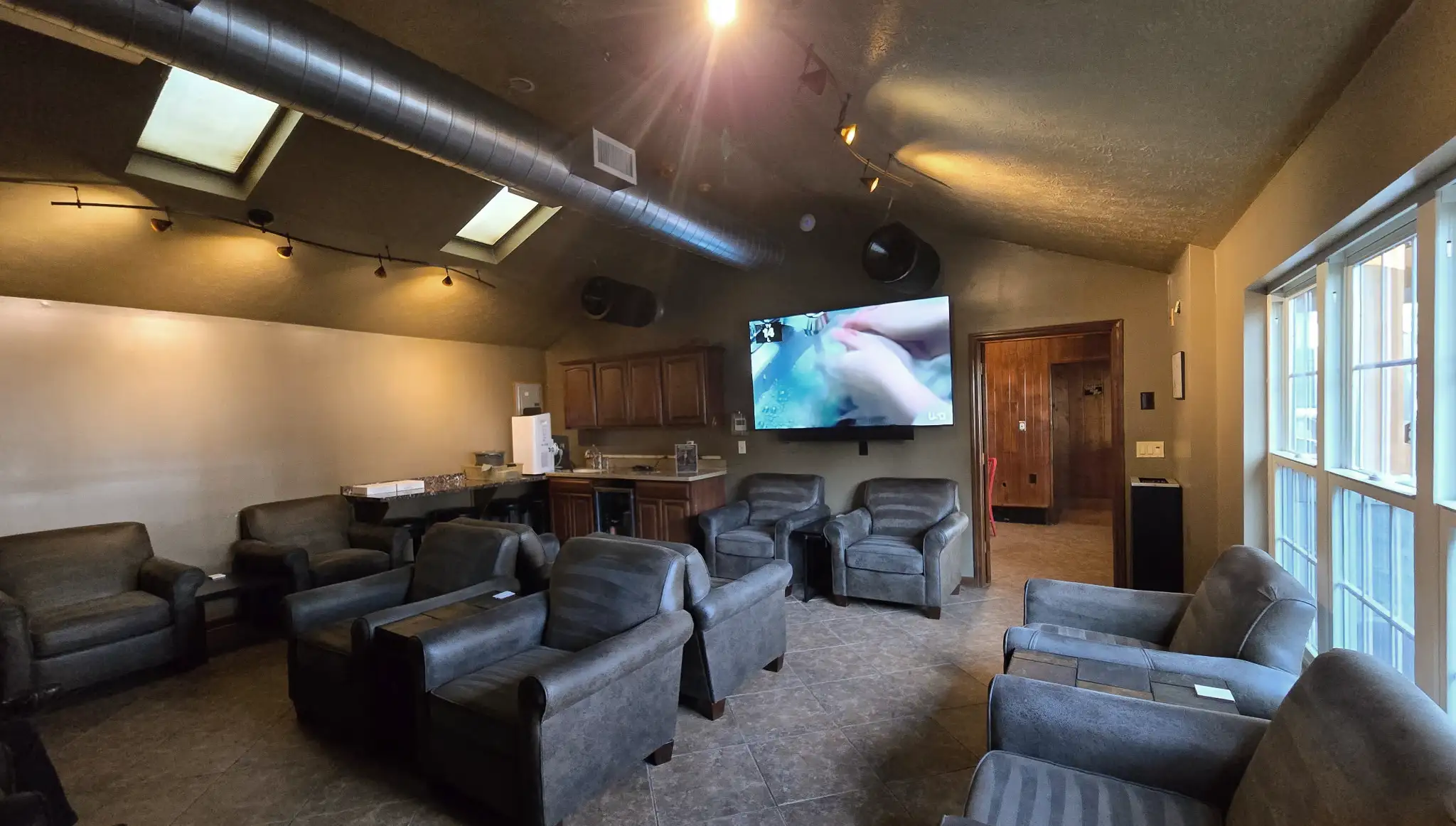 Main lounge with large screen televisions at Summit Cigar Co. in Akron, Ohio